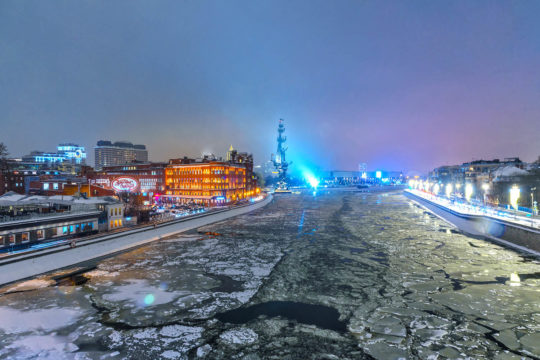 View of Prechistenskaya Naberezhnaya and Peter the Great Statue from Patriarshy Bridge at night in winter. Moscow Russia View of Prechistenskaya Naberezhnaya and Peter the Great Statue from Patriarshy Bridge at night in winter. Moscow Russia