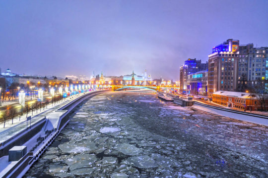 View of Moscow Kremlin and Bolshoy Kamenny Bridge from Patriarshy Bridge at night in winter. Moscow. Russia View of Moscow Kremlin and Bolshoy Kamenny Bridge from Patriarshy Bridge at night in winter. Moscow. Russia